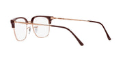 Brown prescription eyewear frames angled side view with rectangular demo lenses and metal temples