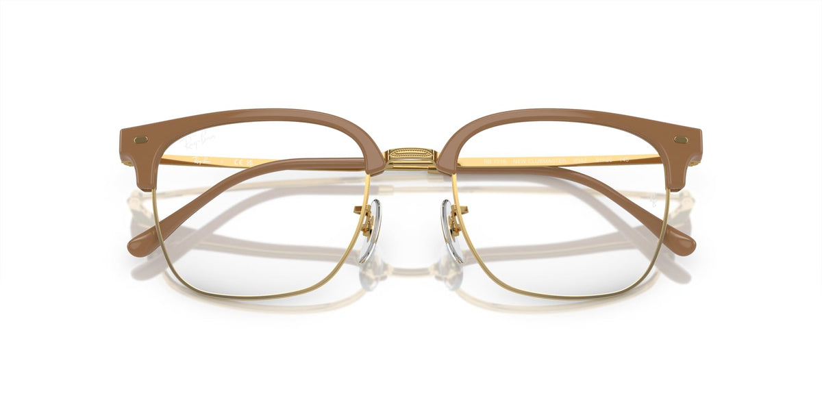 Prescription eyewear frames, brown acetate with gold bridge detail and clear demo lenses