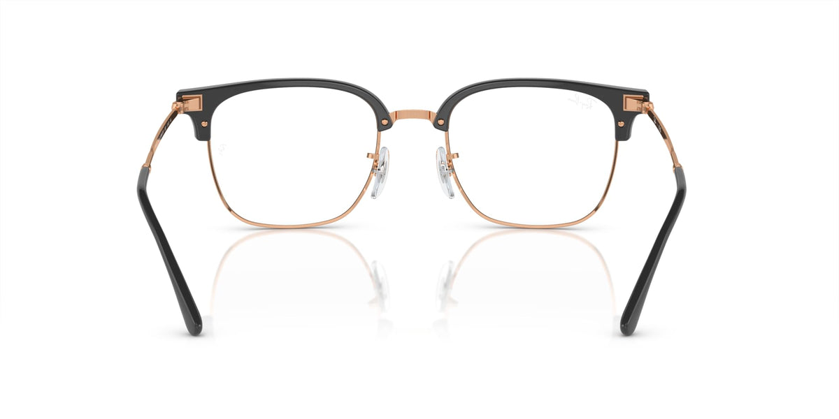 Prescription eyeglass frames front view in black with rose-gold detailing and clear lenses