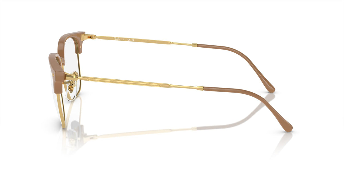 Prescription eyewear frames, brown acetate browline with gold metal arms and clear demo lenses