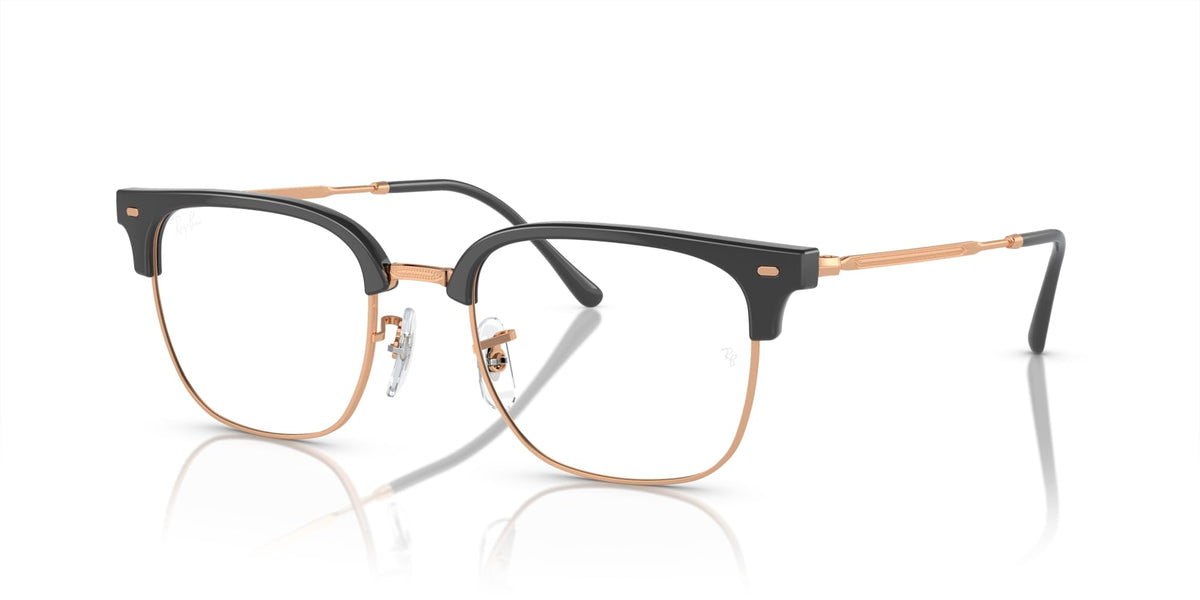 Prescription eyeglass frames, black frame with rose-gold metal bridge and clear lenses