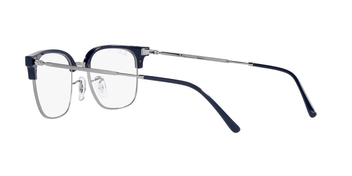 Prescription eyeglass frames with dark blue front, clear lenses, and angled metal temple tips