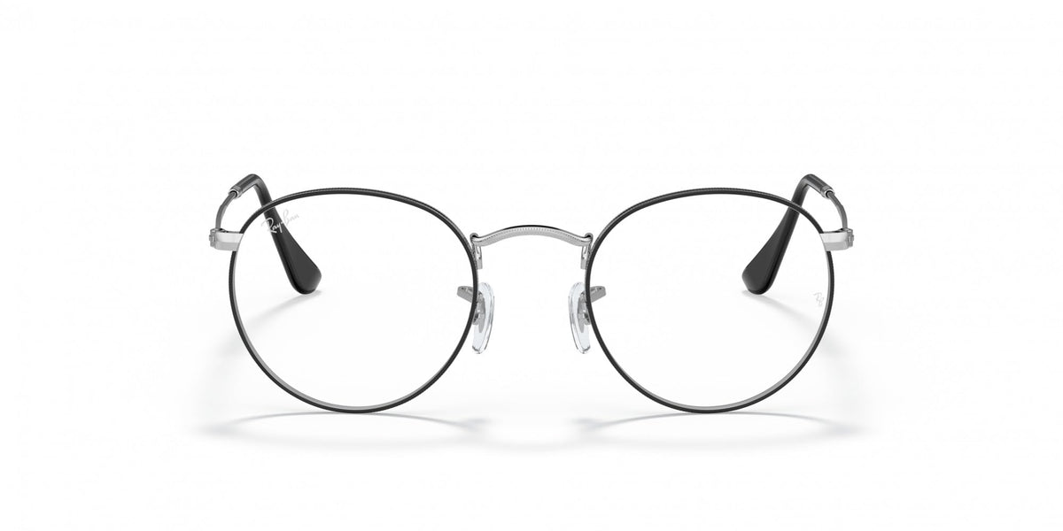 Round prescription eyewear frames with clear lenses, black temple accents and silver-tone rims