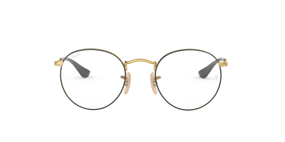 Gold round eyeglass frames with clear demo lenses and curved metal bridge.