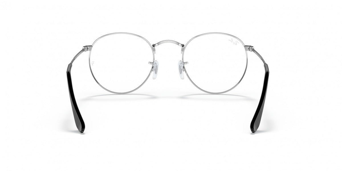 Round prescription eyewear frames with clear lenses, silver-tone rims and black outer temple tips