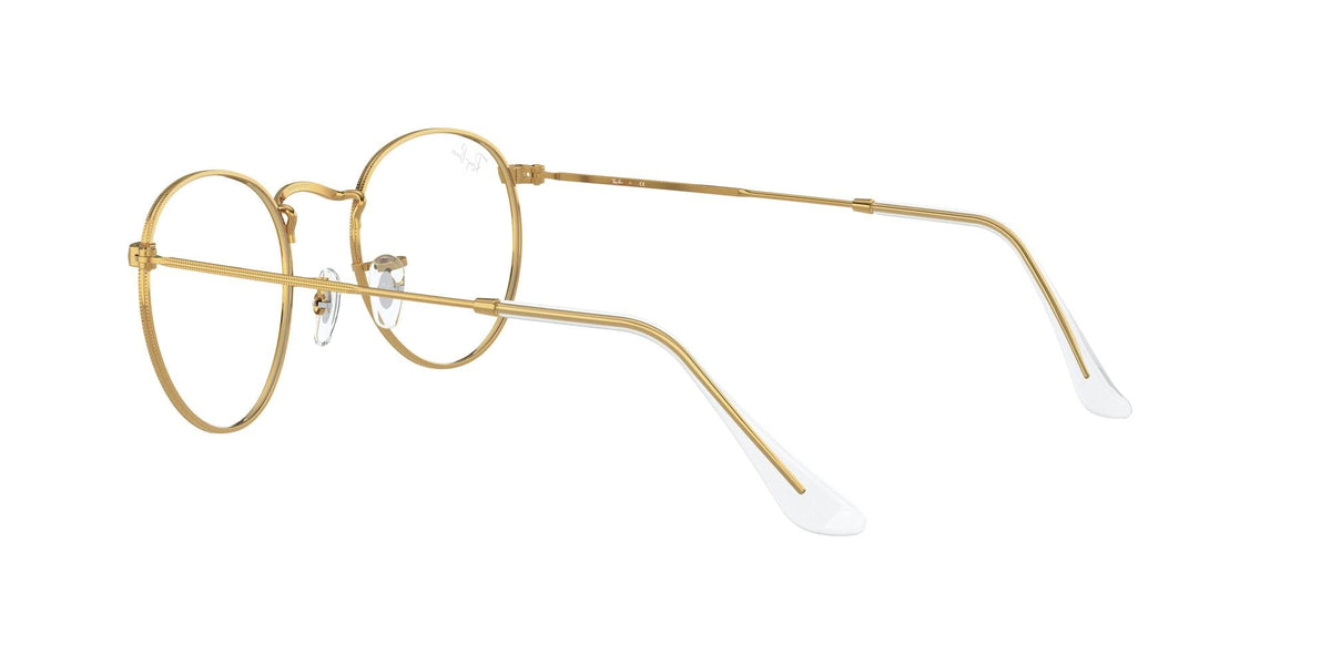Gold-tone round metal prescription eyewear frames, angled side view with clear lenses
