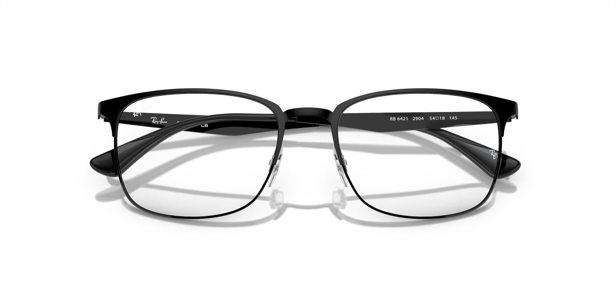 Black eyeglass frames with rectangular clear lenses and visible temple branding, demo lenses
