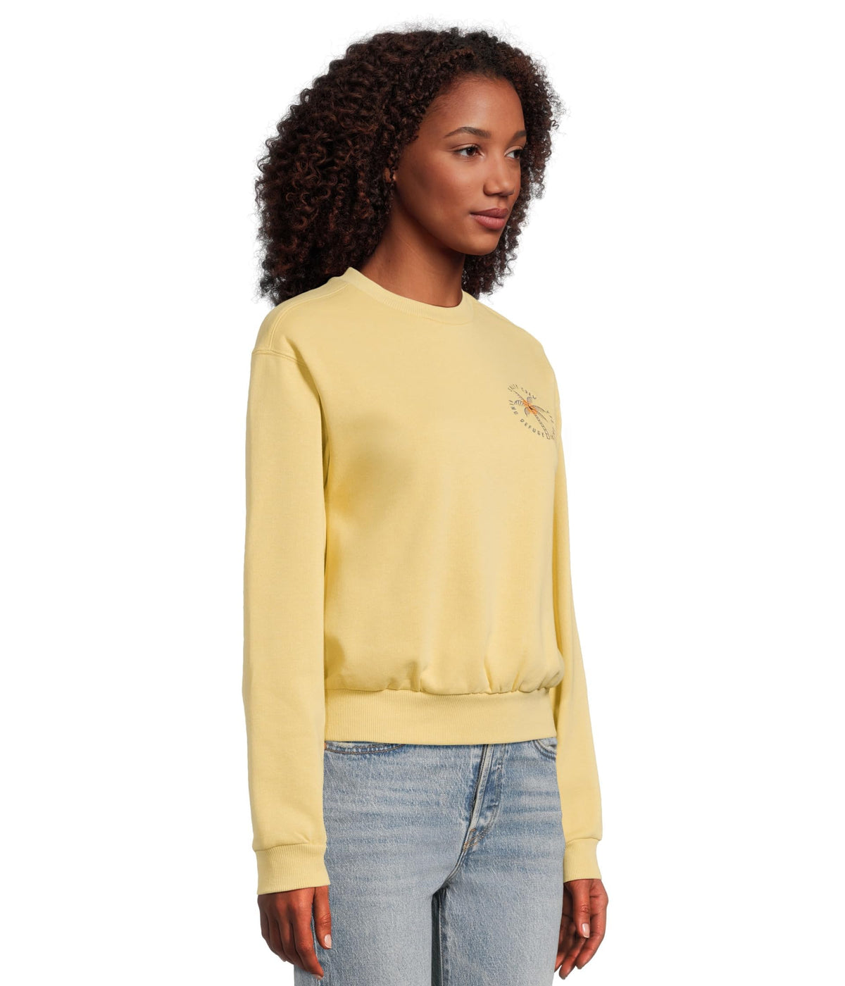 Women’s crewneck sweatshirt in dusty gold, side view with palm tree chest graphic