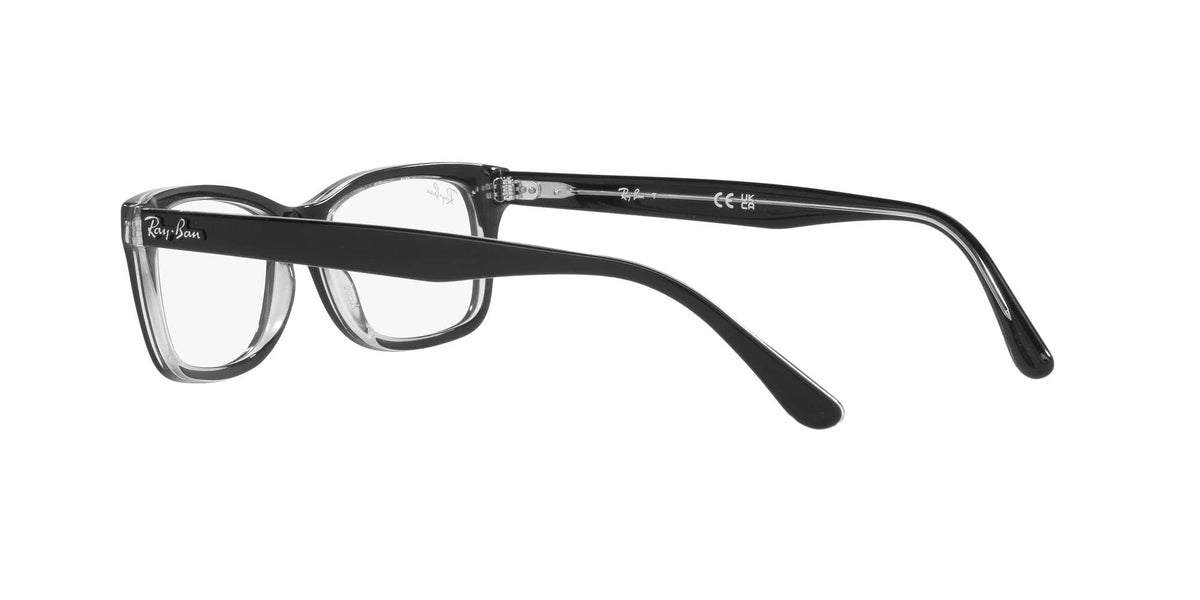 Prescription eyewear frames, clear front with dark top bar and black temples, side view