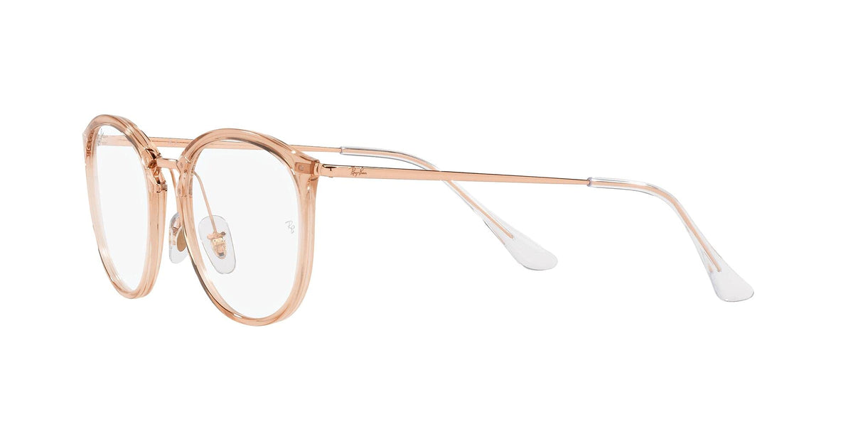 Transparent rose-gold eyeglass frames shown from the side with metal arms