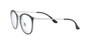 Transparent clear eyeglass frames with dark nose pads and black temple accents