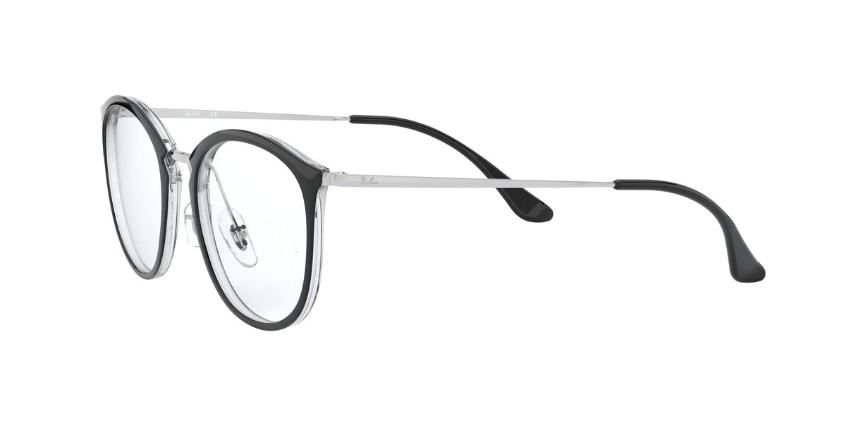 Transparent clear eyeglass frames with dark nose pads and black temple accents