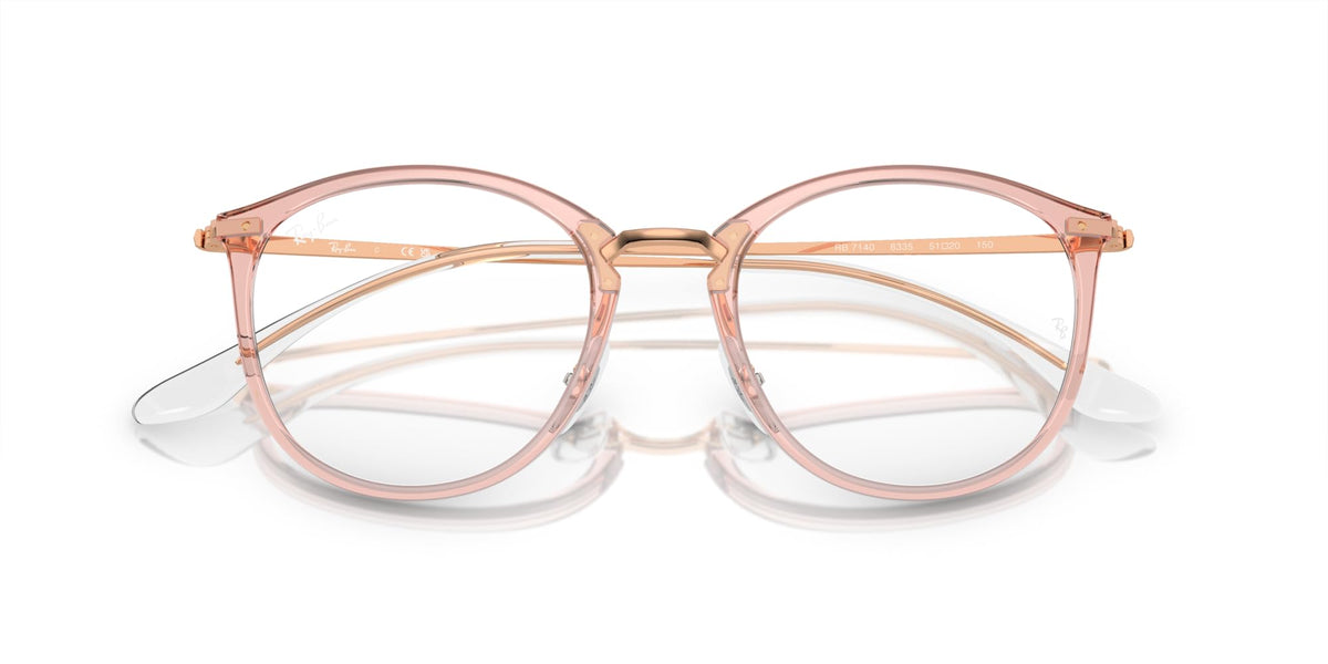 Rose pink round eyeglass frames with demo lenses and curved bridge, angled view