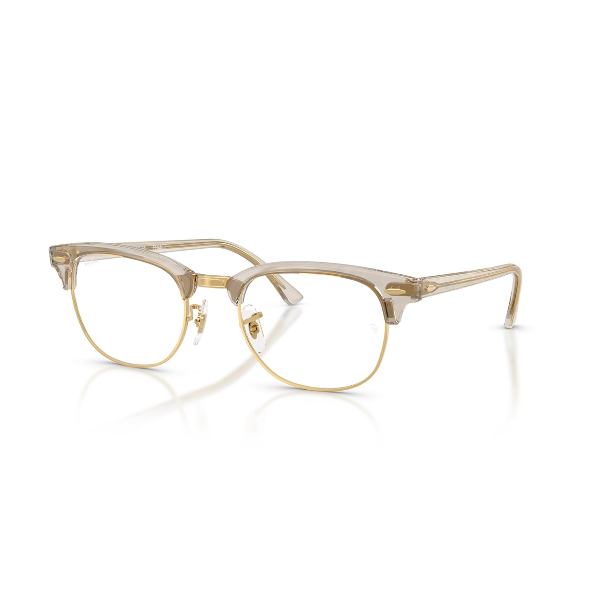 Clear prescription eyewear frames with light gold-tone rims and clear lenses