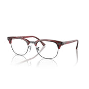 Red-brown tortoise prescription eyewear frame with clear lenses and rounded front