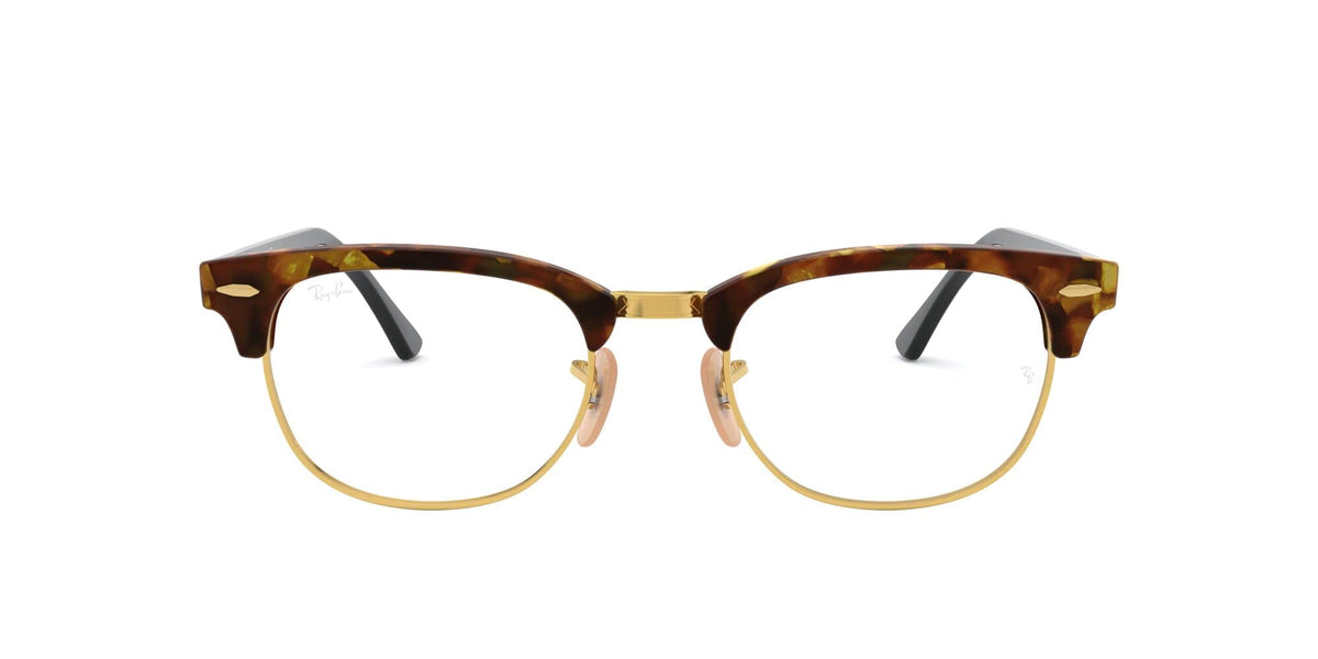 Tortoise prescription eyewear frames with clear lenses and gold-tone metal accents