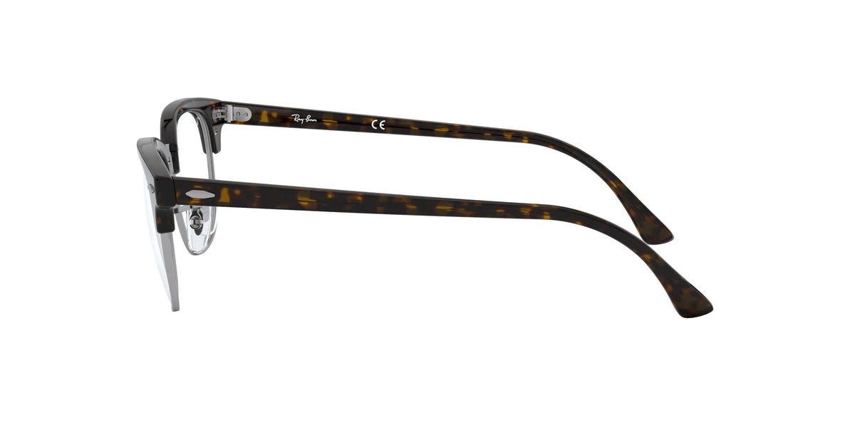 Prescription eyewear frame in dark with patterned temple arms and clear lenses