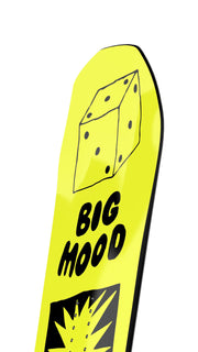 Yellow snowboard nose with “Big Mood” text and dice-like square logo