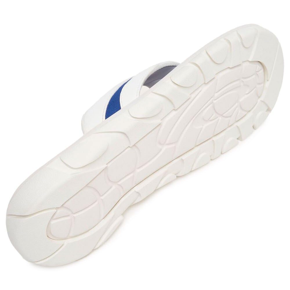 White sandal outsole with textured tread and blue strap underside