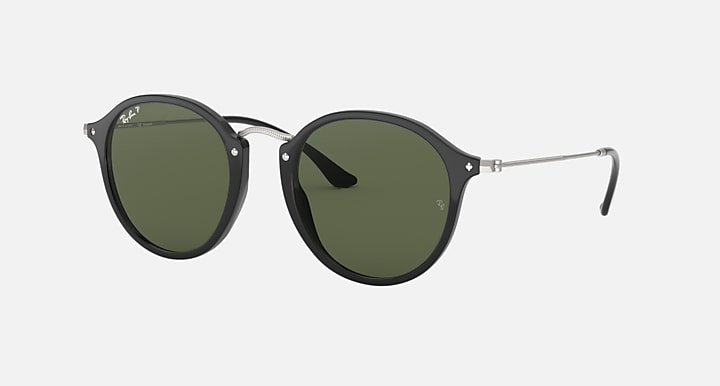 Ray-Ban round sunglasses with black frame and green polarized lenses, side view