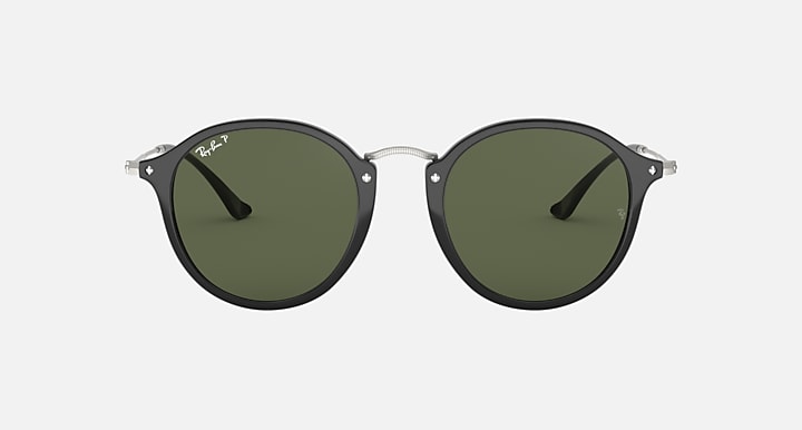 Ray-Ban round sunglasses with black frame and green polarized lenses, front view
