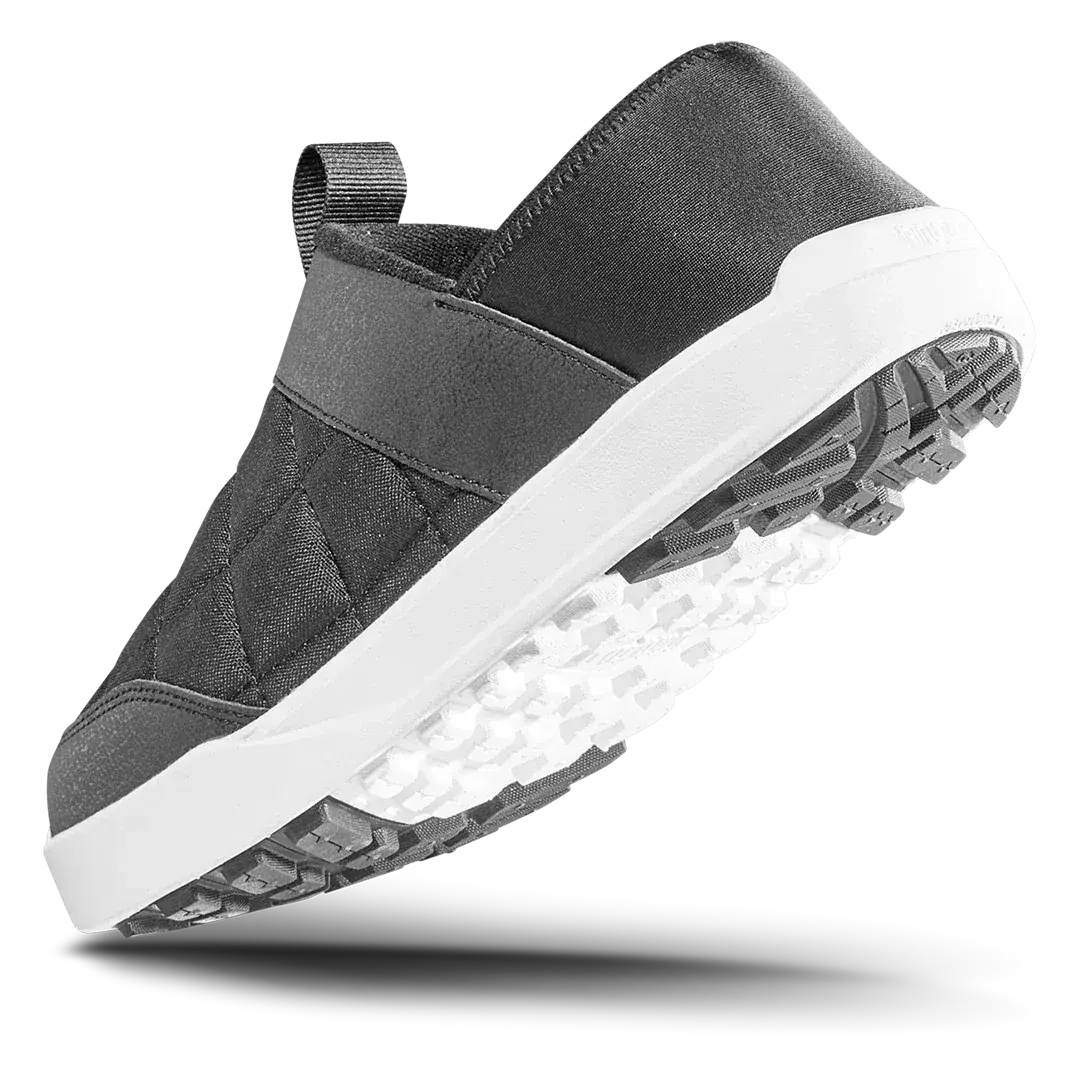 Men's black slip-on shoes with quilted upper, padded heel strap, and textured white outsole