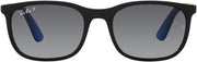 Kids sunglasses with black frame and dark grey gradient lenses, blue temple accents.